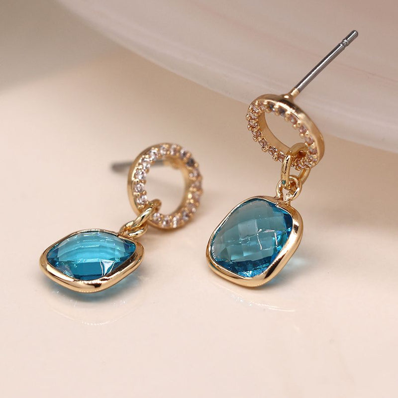 Faux gold plated crystal circle and aqua drop earrings