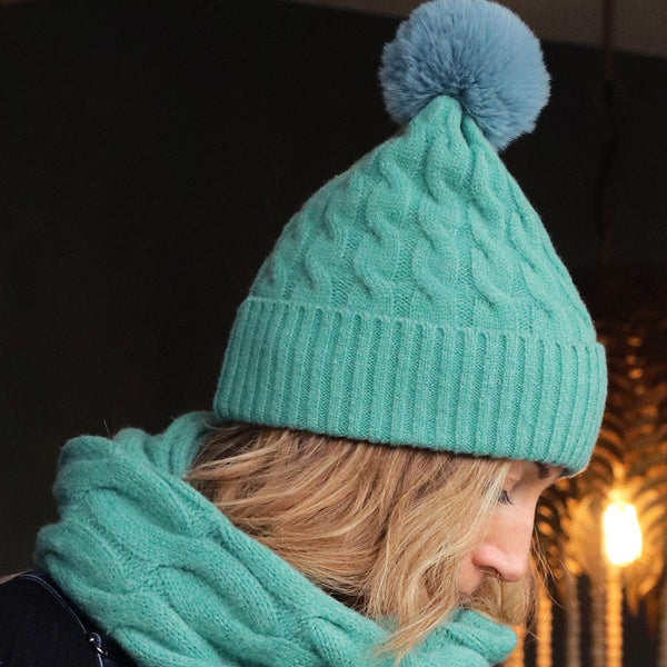 50% recycled green cable knit and faux fur bobble hat