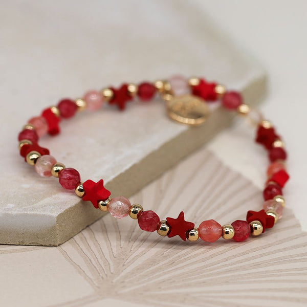 Golden and raspberry bead bracelet with pink stars